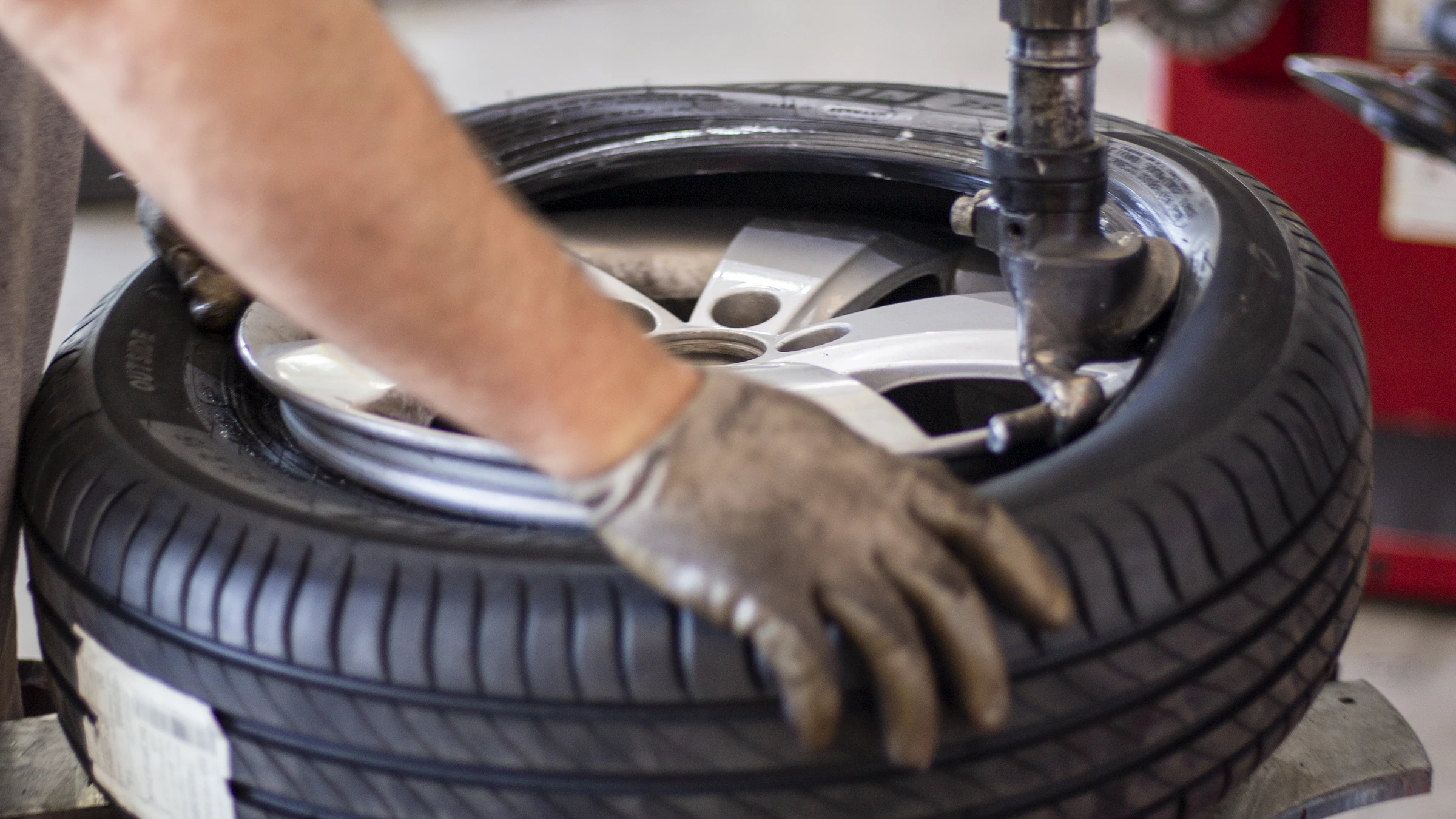 A technician mounting a tire